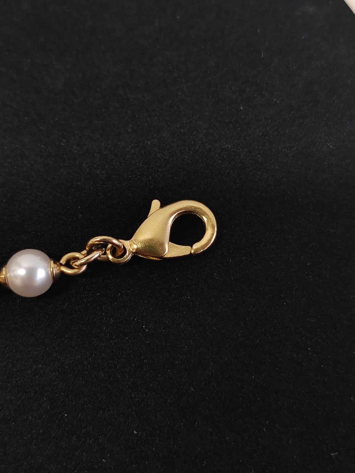 Chanel - Other - Gold-tone metal with faux pearl-style beads and enamel accents. - Multicolour