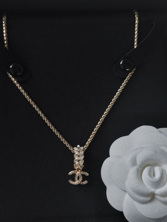 Chanel - Other - Gold-tone metal with glass rhinestone embellishments; exact composition unverified. - Gold