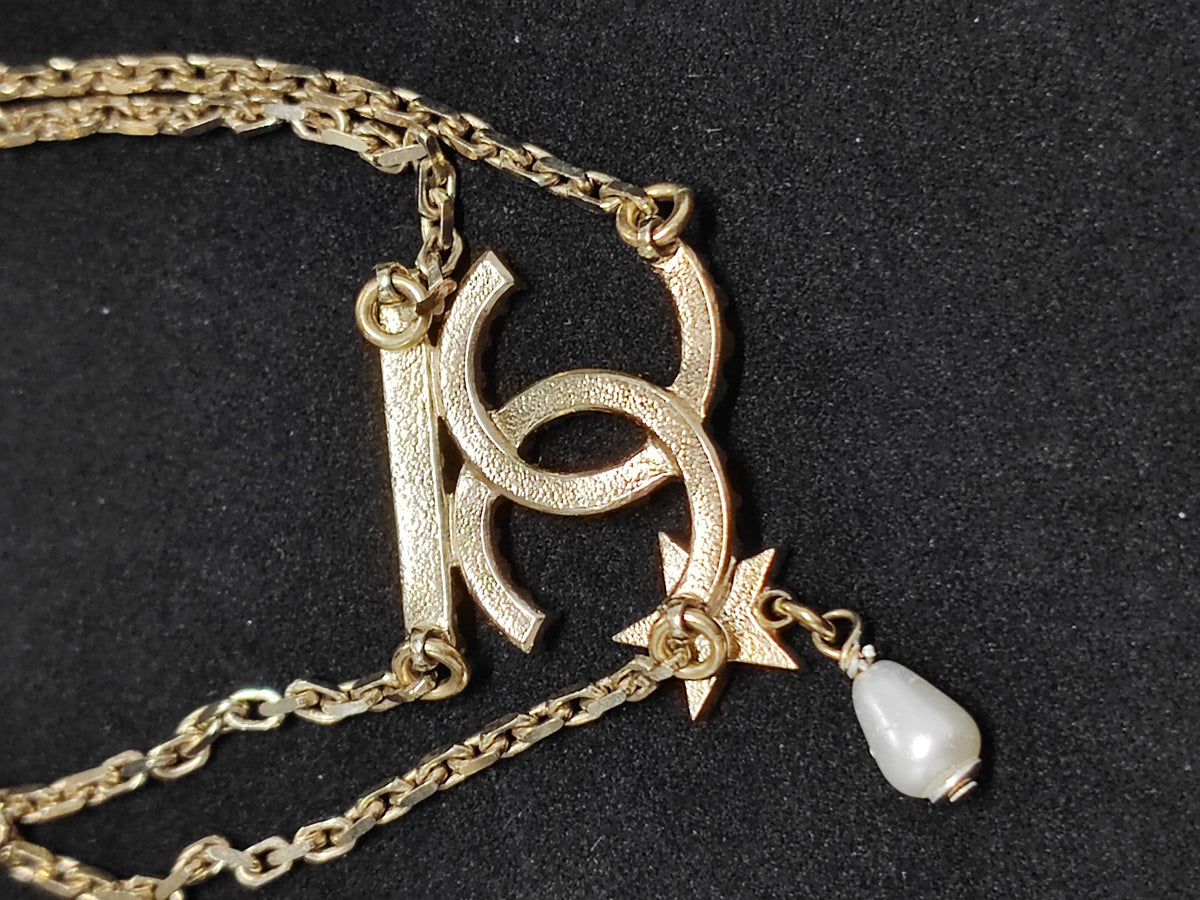 Chanel - Other - Gold-tone metal with glass rhinestones and a faux-pearl drop. - Gold