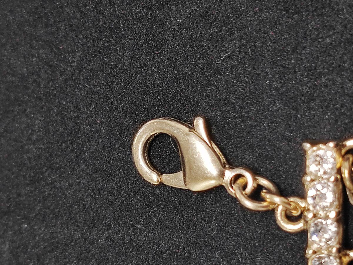 Chanel - Other - Gold-tone metal with glass rhinestones and a faux-pearl drop. - Gold