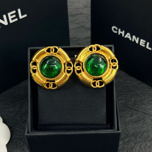 Chanel - Other - Gold-tone metal with green glass cabochons. - Multicolour