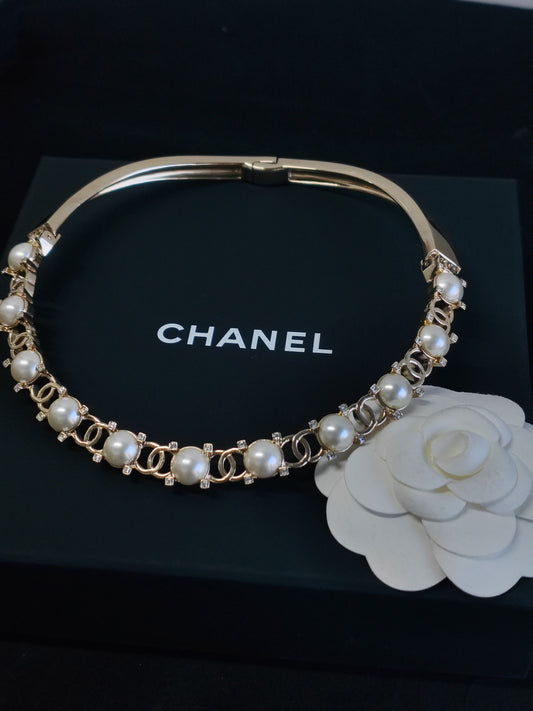Chanel - Other - Gold-tone metal with imitation pearls and clear rhinestone-style accents. - Gold