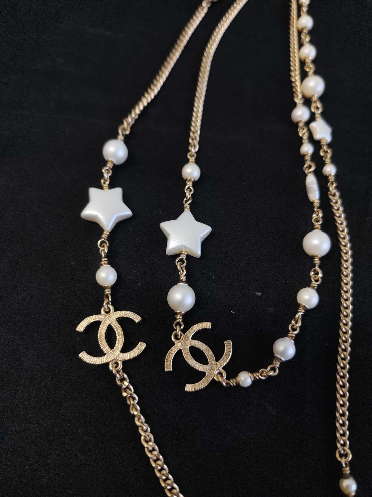Chanel - Other - Gold-tone metal with imitation pearls and star-shaped resin accents. - Gold
