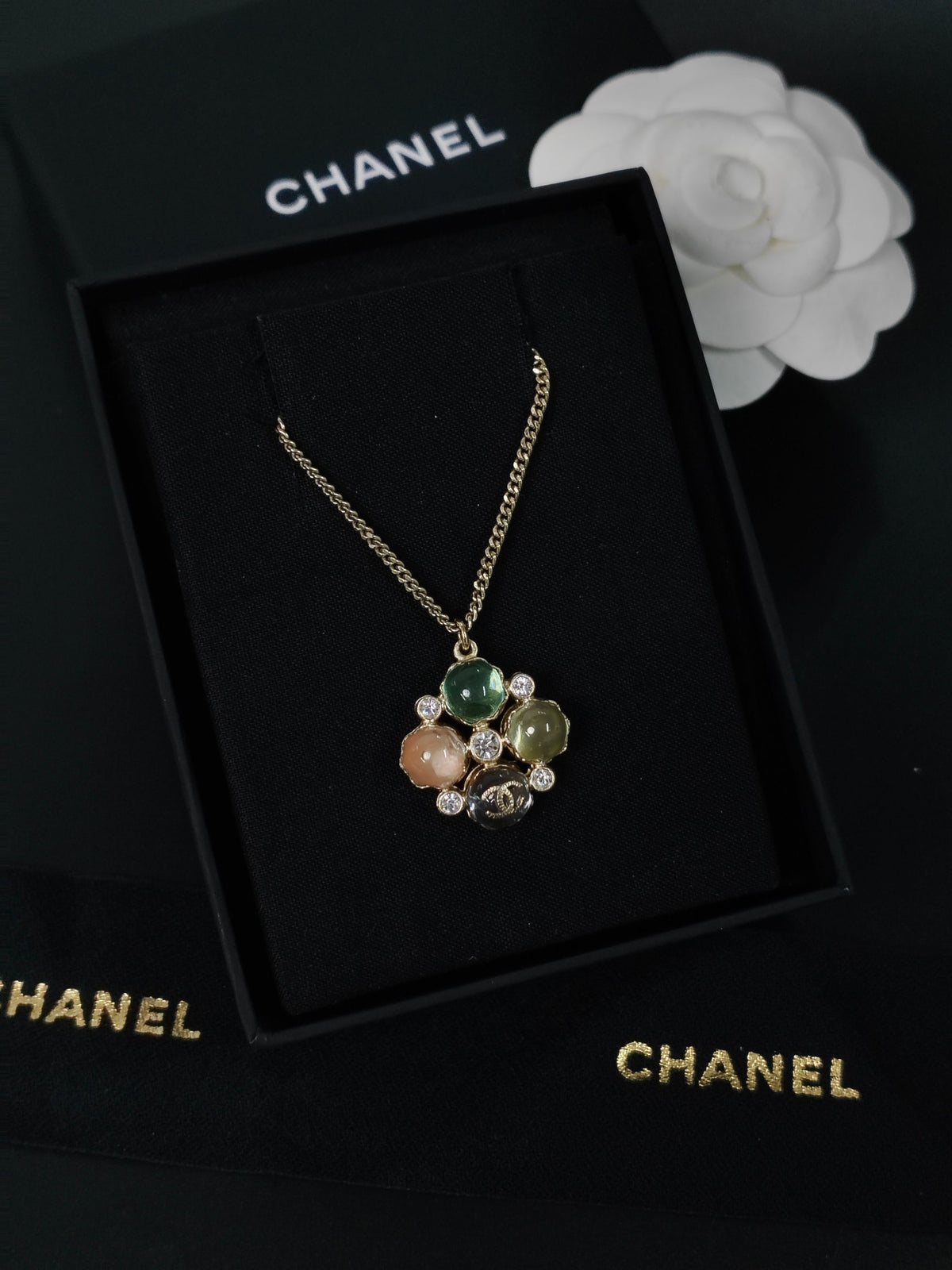 Chanel - Other - Gold-tone metal with multicolour cabochon-style elements and clear faceted accents; exact stone materials are unconfirmed. - Multicolour
