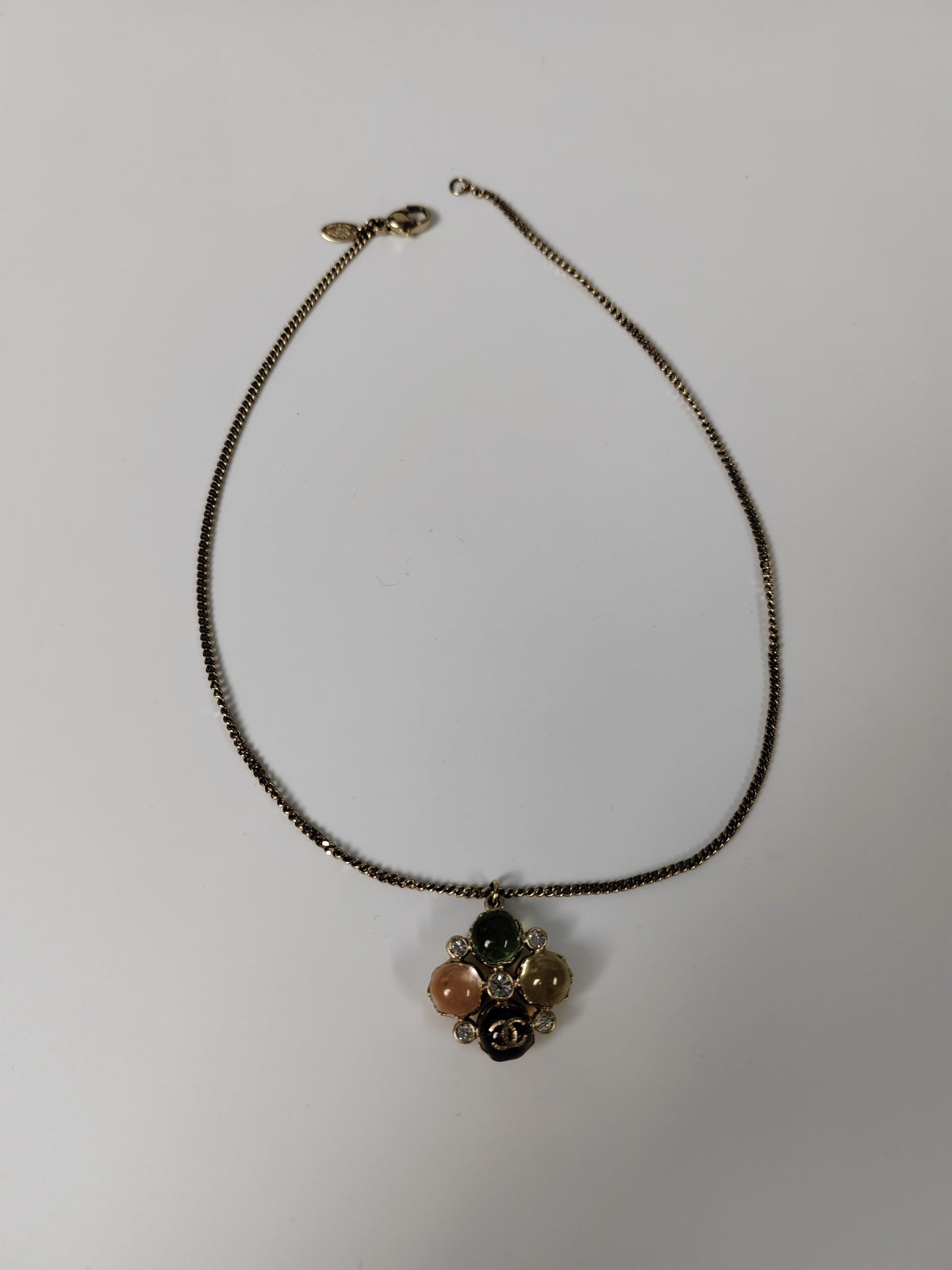 Chanel - Other - Gold-tone metal with multicolour cabochon-style elements and clear faceted accents; exact stone materials are unconfirmed. - Multicolour