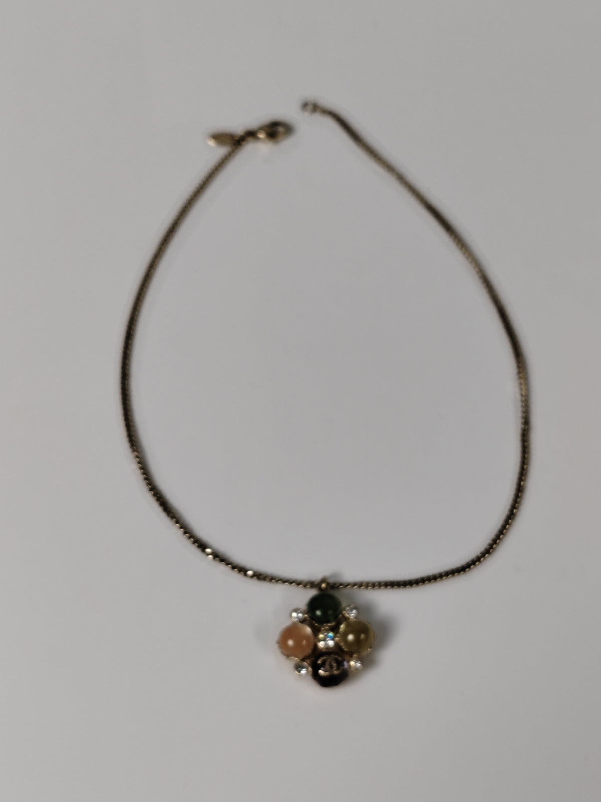 Chanel - Other - Gold-tone metal with multicolour cabochon-style elements and clear faceted accents; exact stone materials are unconfirmed. - Multicolour