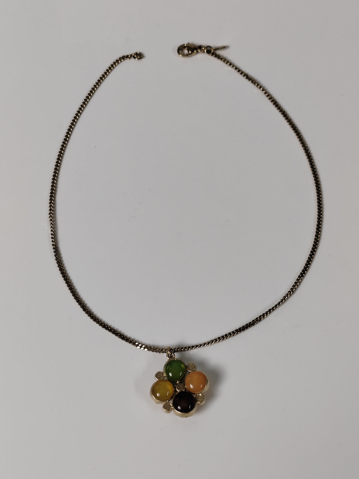 Chanel - Other - Gold-tone metal with multicolour cabochon-style elements and clear faceted accents; exact stone materials are unconfirmed. - Multicolour