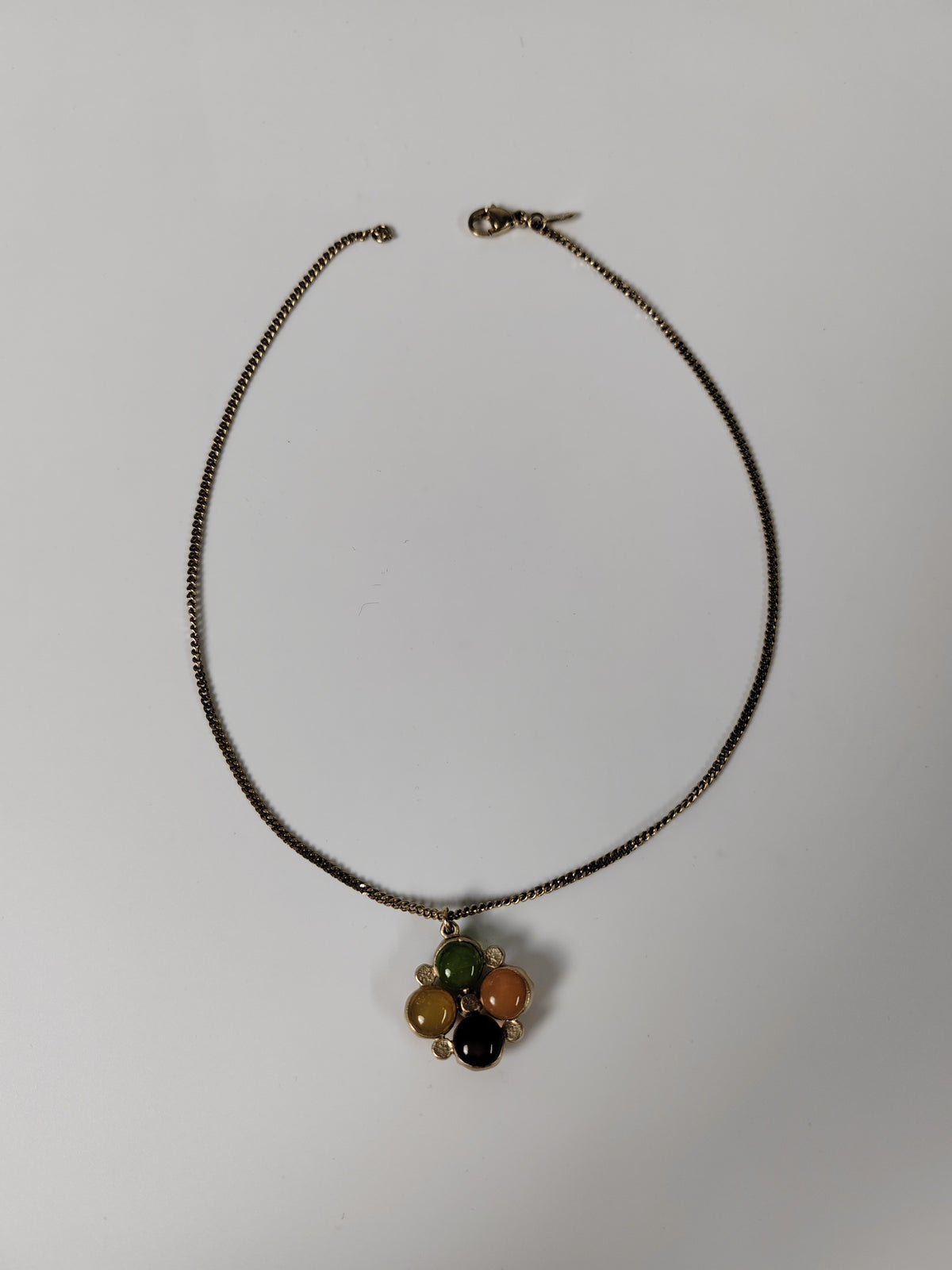 Chanel - Other - Gold-tone metal with multicolour cabochon-style elements and clear faceted accents; exact stone materials are unconfirmed. - Multicolour
