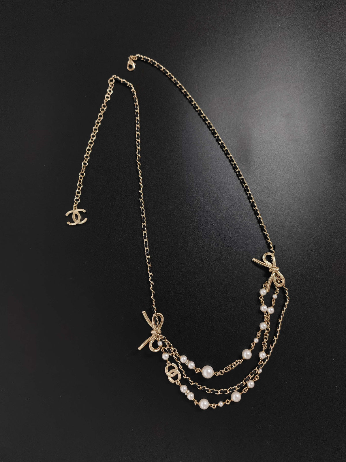 Chanel - Other - Gold-tone metal with pearl accents and black leather. - Multicolour