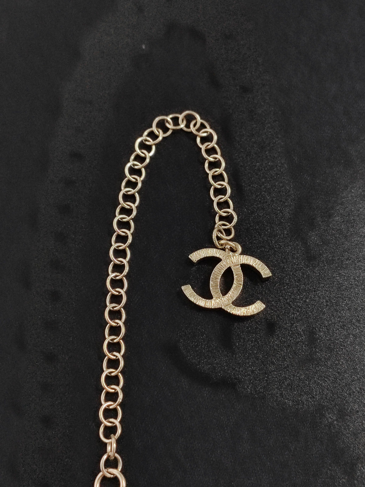 Chanel - Other - Gold-tone metal with pearl accents and black leather. - Multicolour
