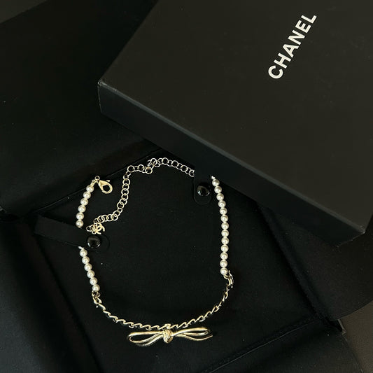 Chanel - Other - Gold-tone metal with pearl accents and lambskin leather. - Multicolour