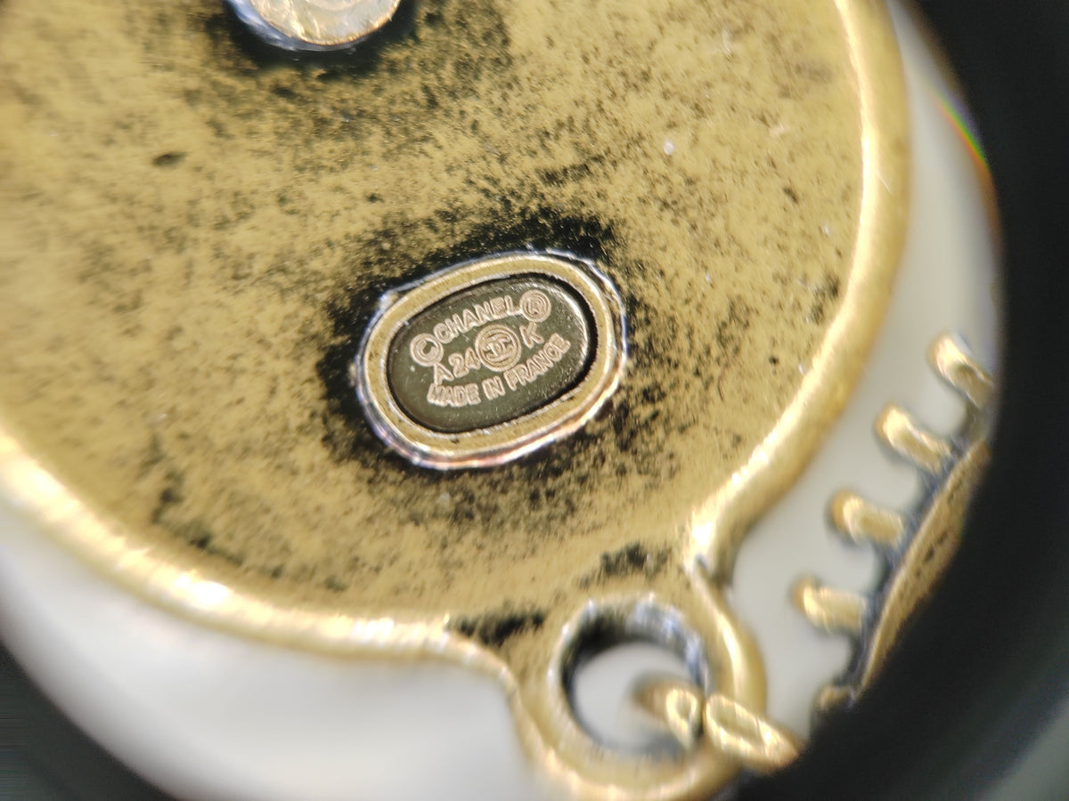 Chanel - Other - Gold-tone metal with pearl-effect and white enamel accents; exact metal composition unspecified. - Multicolour
