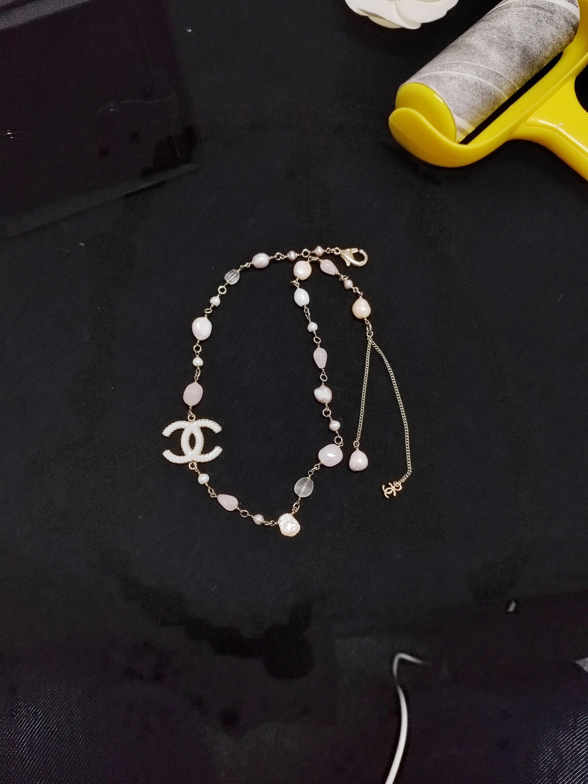 Chanel - Other - Gold-tone metal with pearl-like and pink beads. - Multicolour