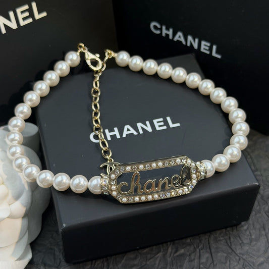 Chanel - Other - Gold-tone metal with pearl-like beads and crystal embellishments. - White