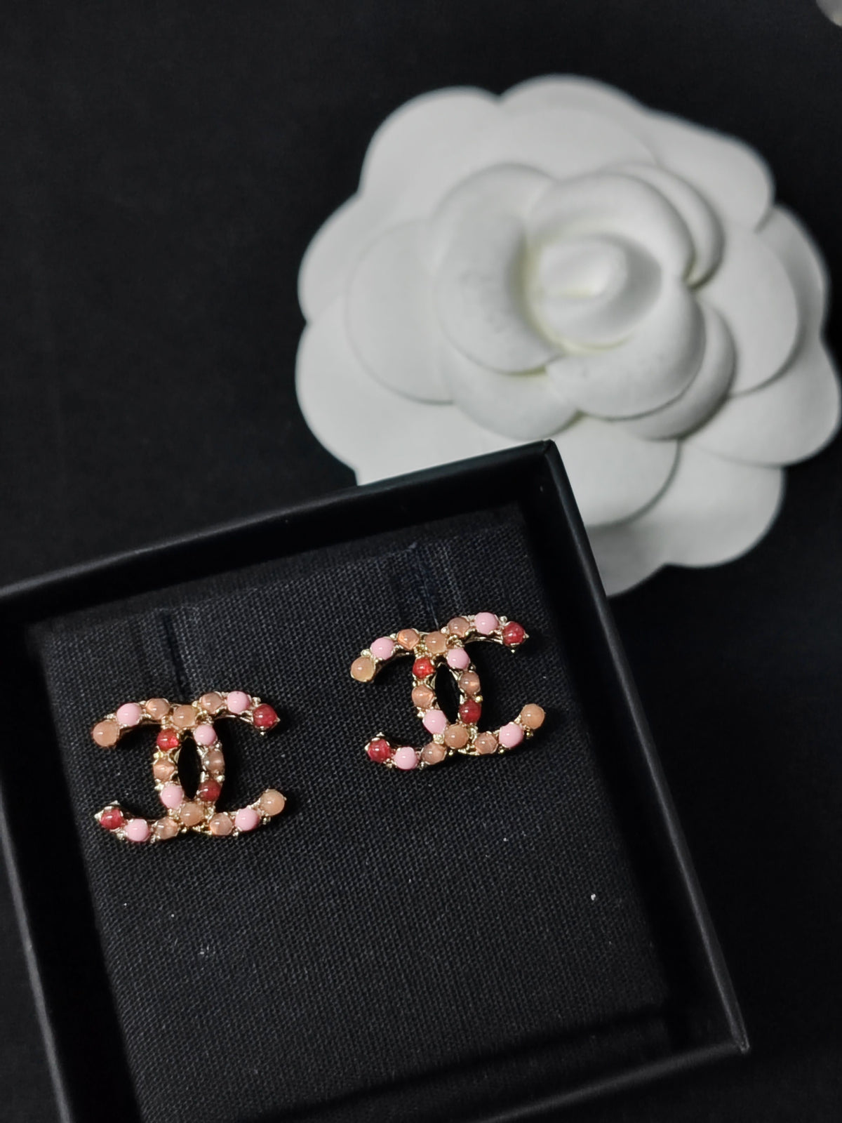 Chanel - Other - Gold-tone metal with pink, orange and red faux pearl-like embellishments. - Multicolour