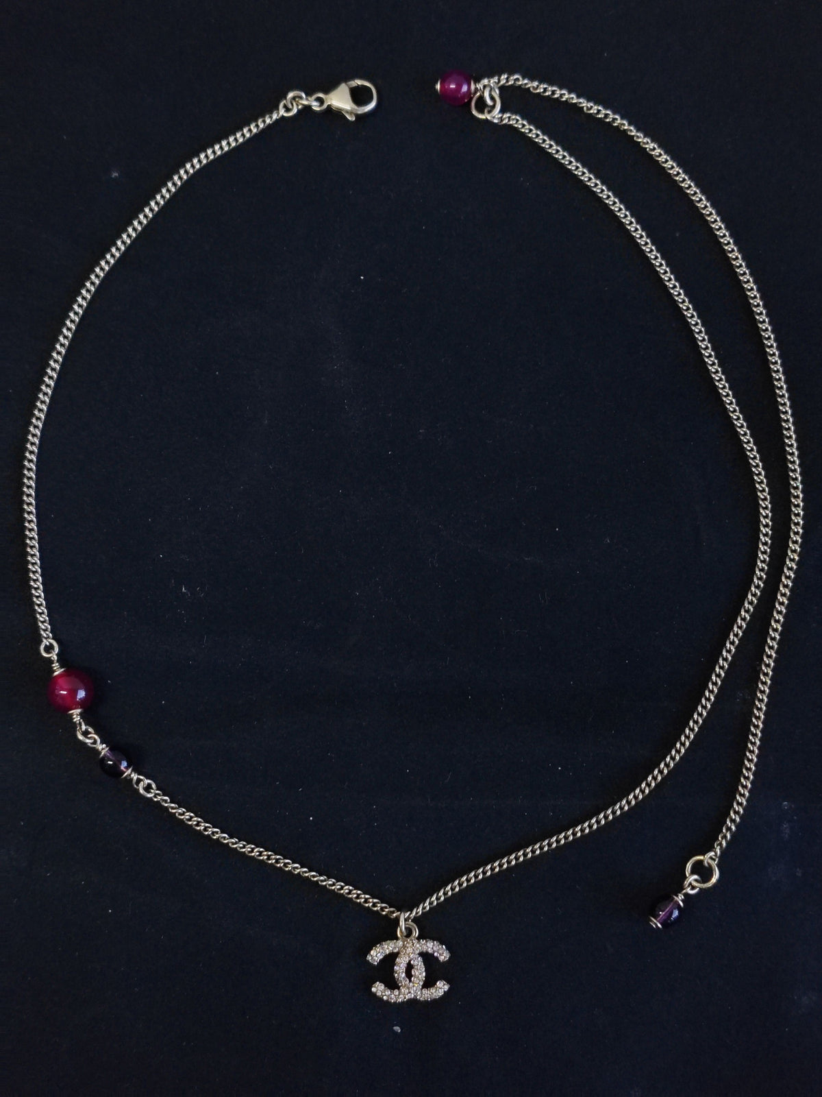 Chanel - Other - Gold-tone metal with purple glass beads and clear rhinestone embellishment; composition not verified. - Multicolour