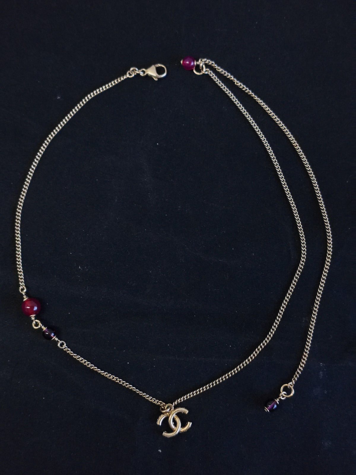 Chanel - Other - Gold-tone metal with purple glass beads and clear rhinestone embellishment; composition not verified. - Multicolour