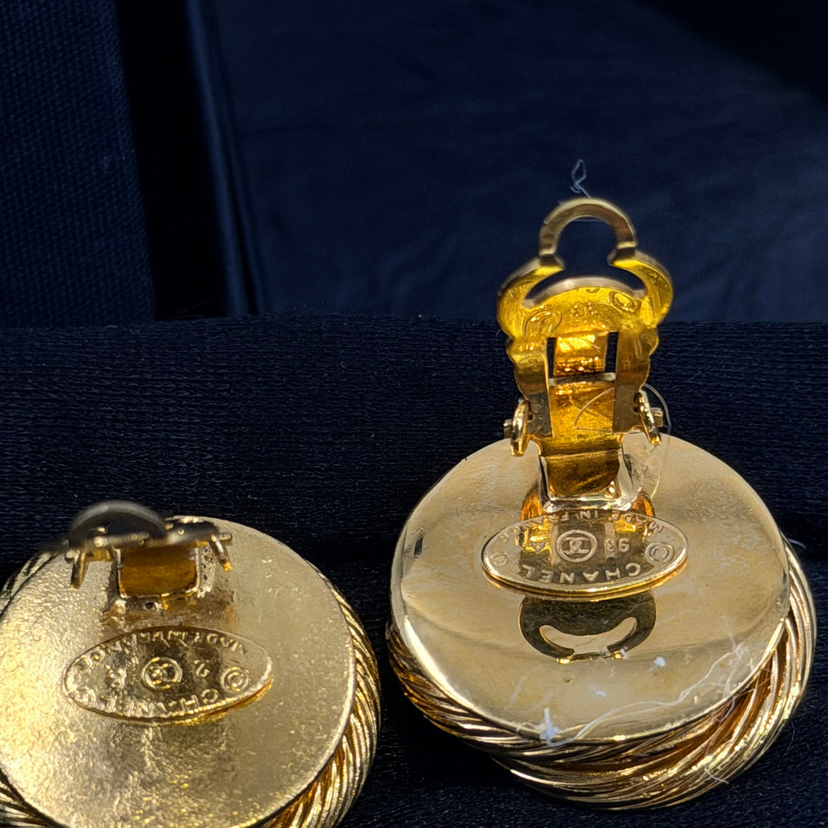 Chanel - Other - Gold-tone metal with red glass cabochons and clear rhinestone accents; exact metal composition is unconfirmed. - Multicolour