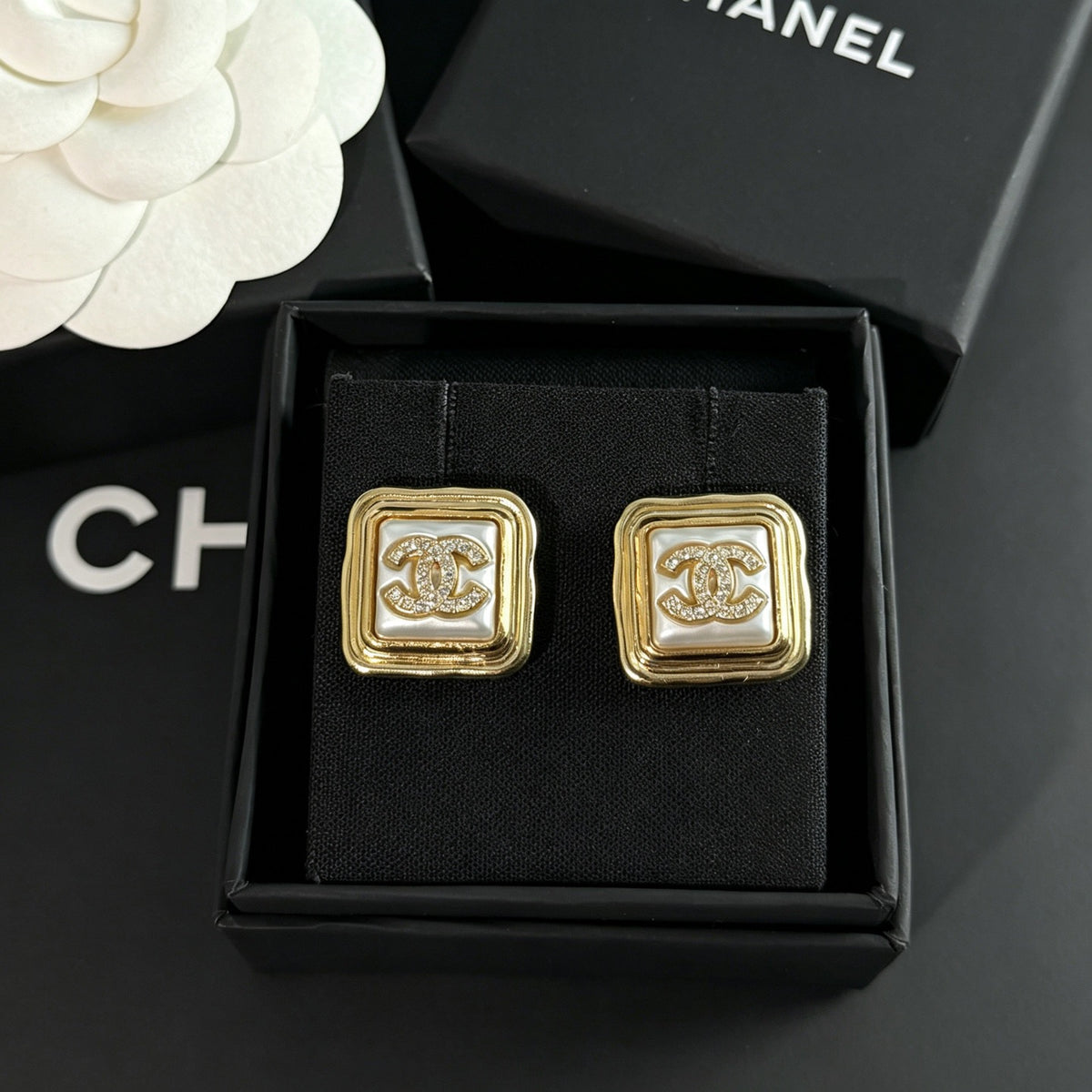 Chanel - Other - Gold-tone metal with rhinestone embellishments; the white inset material is unconfirmed. - Gold