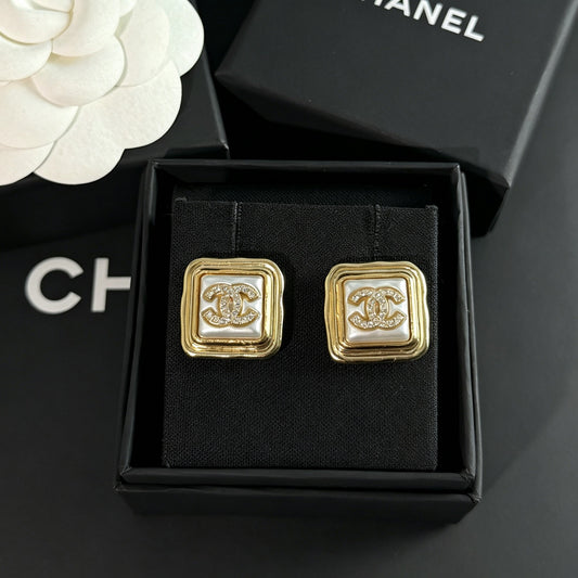 Chanel - Other - Gold-tone metal with rhinestone embellishments; the white inset material is unconfirmed. - Gold
