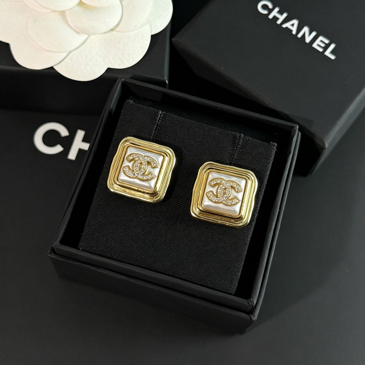 Chanel - Other - Gold-tone metal with rhinestone embellishments; the white inset material is unconfirmed. - Gold
