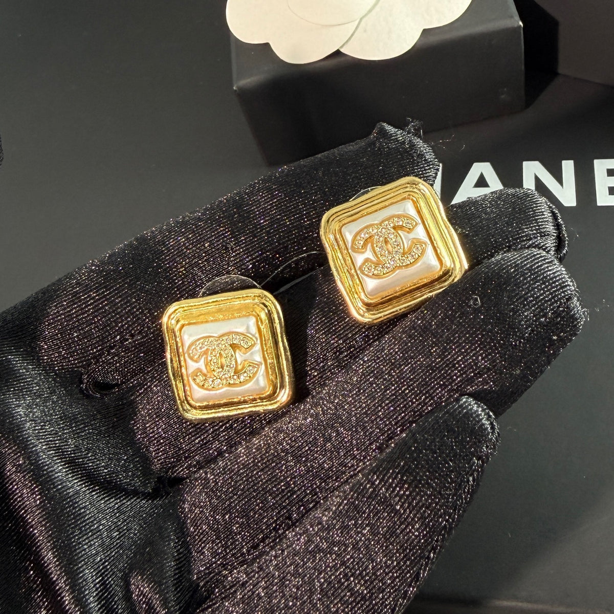 Chanel - Other - Gold-tone metal with rhinestone embellishments; the white inset material is unconfirmed. - Gold