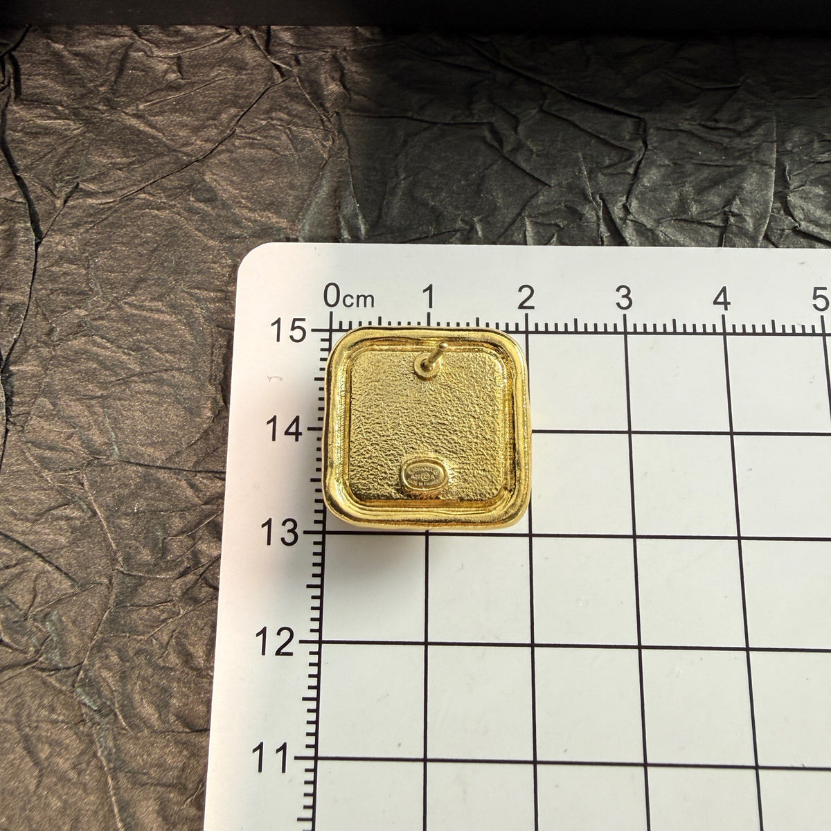 Chanel - Other - Gold-tone metal with rhinestone embellishments; the white inset material is unconfirmed. - Gold