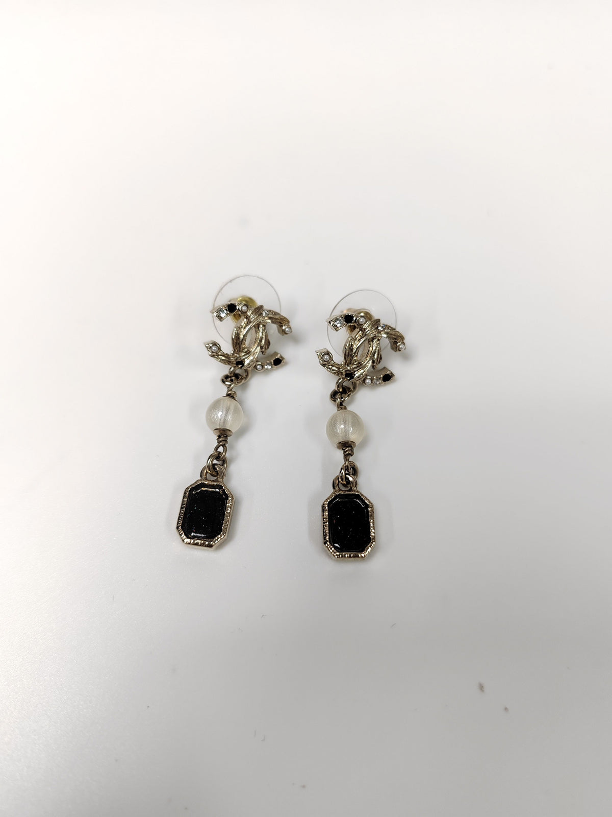 Chanel - Other - Gold-tone metal with rhinestone-style stones and pearl-like and black decorative elements; exact stone and pearl composition is not confirmed. - Multicolour