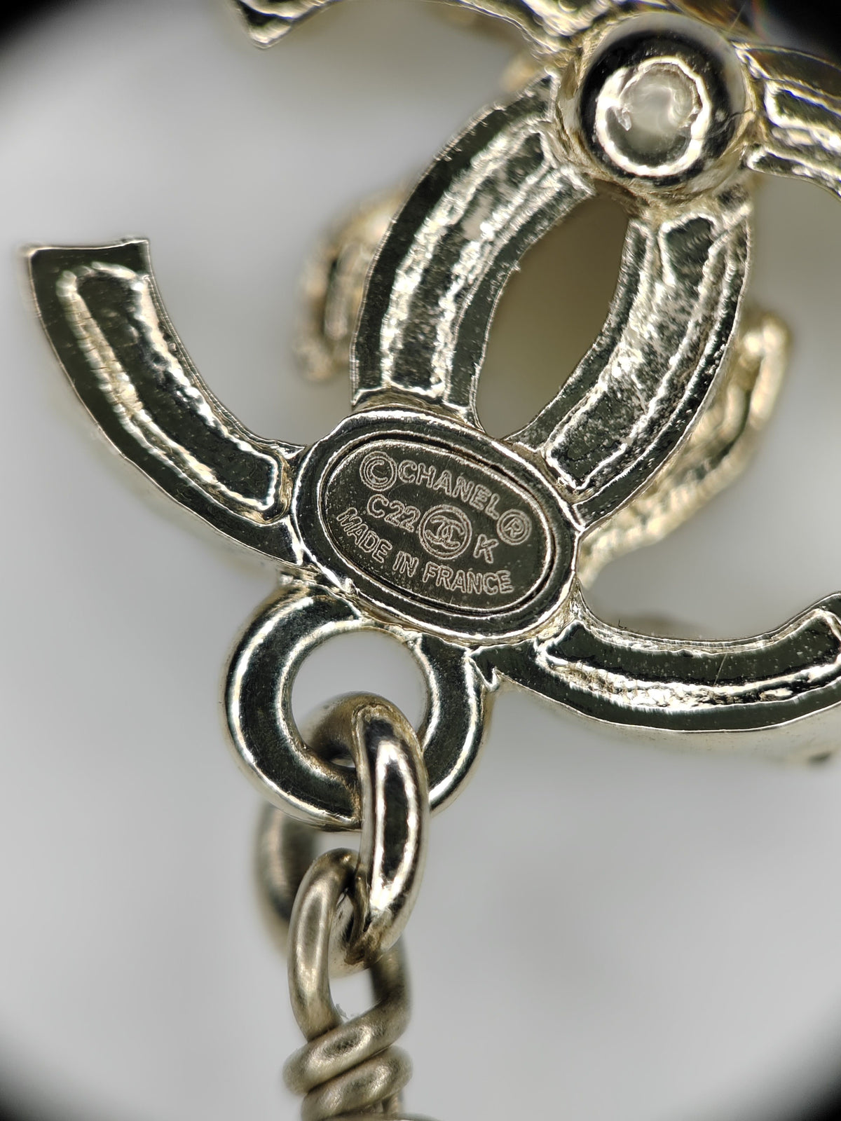 Chanel - Other - Gold-tone metal with rhinestone-style stones and pearl-like and black decorative elements; exact stone and pearl composition is not confirmed. - Multicolour