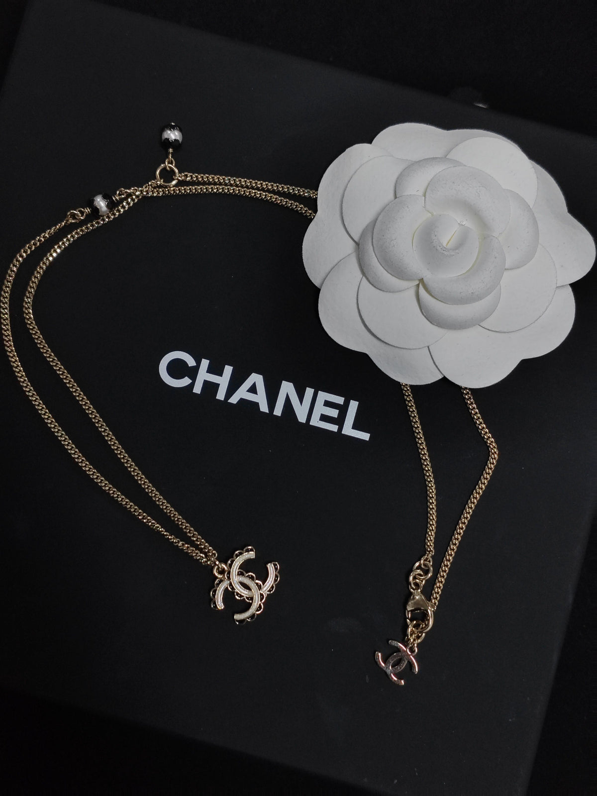 Chanel - Other - Gold-tone metal with white and black decorative accents - Gold