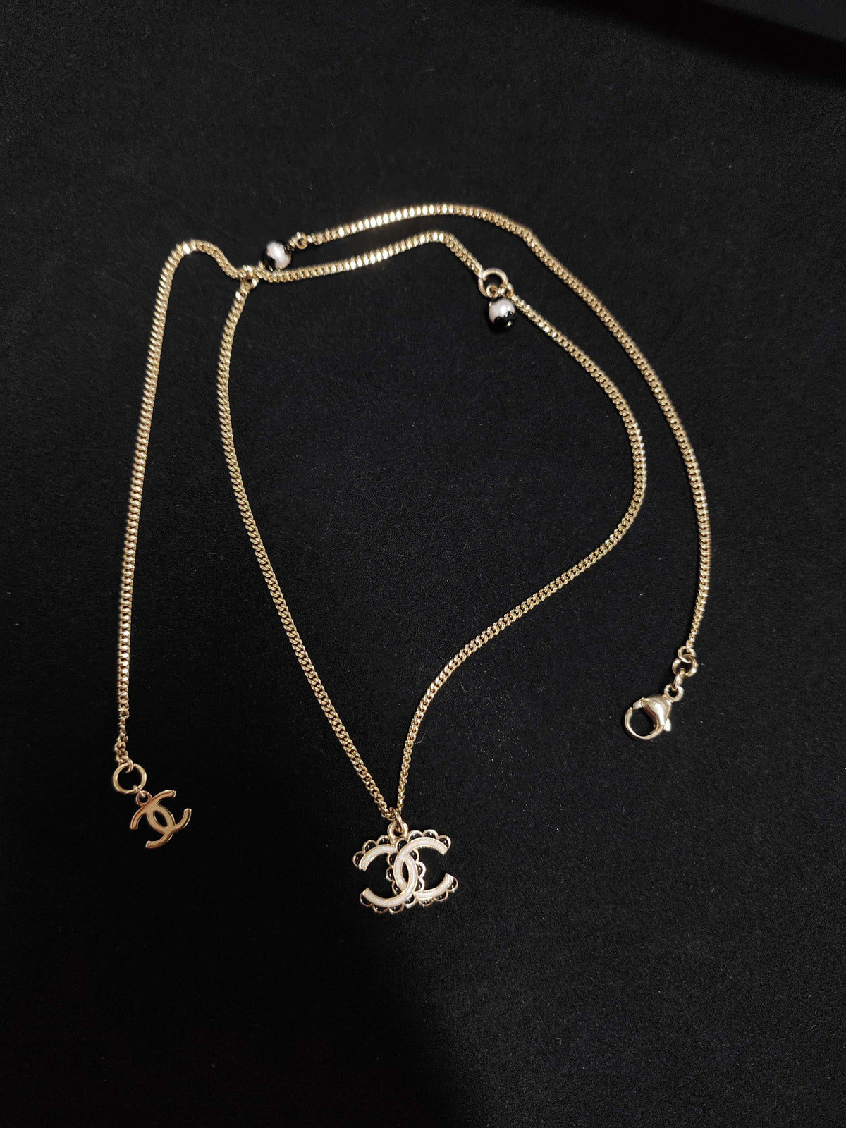 Chanel - Other - Gold-tone metal with white and black decorative accents - Gold