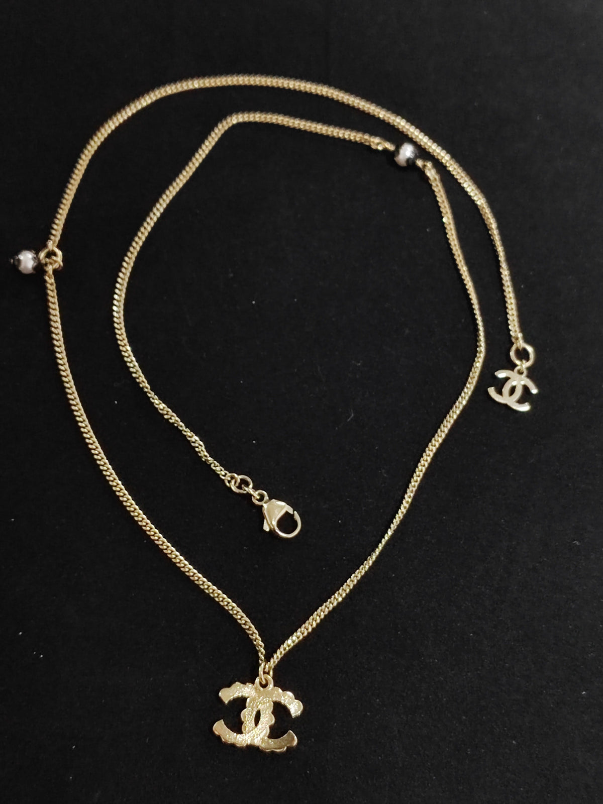 Chanel - Other - Gold-tone metal with white and black decorative accents - Gold