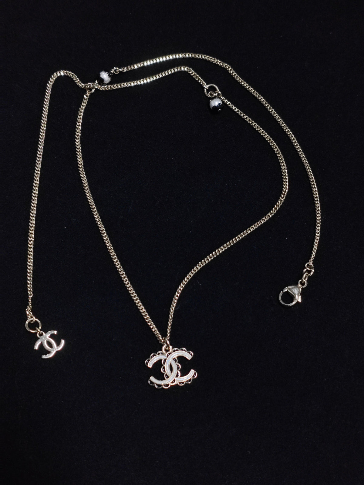 Chanel - Other - Gold-tone metal with white and black decorative accents - Gold