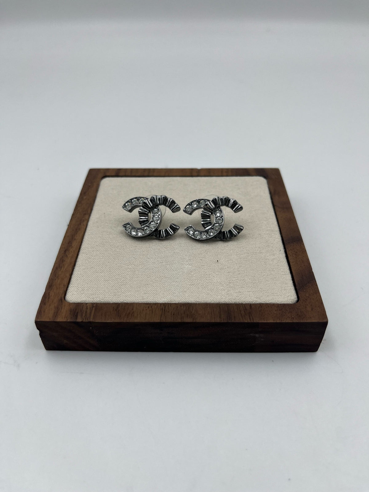 Chanel - Other - Gunmetal-tone metal with clear glass crystals. - Grey