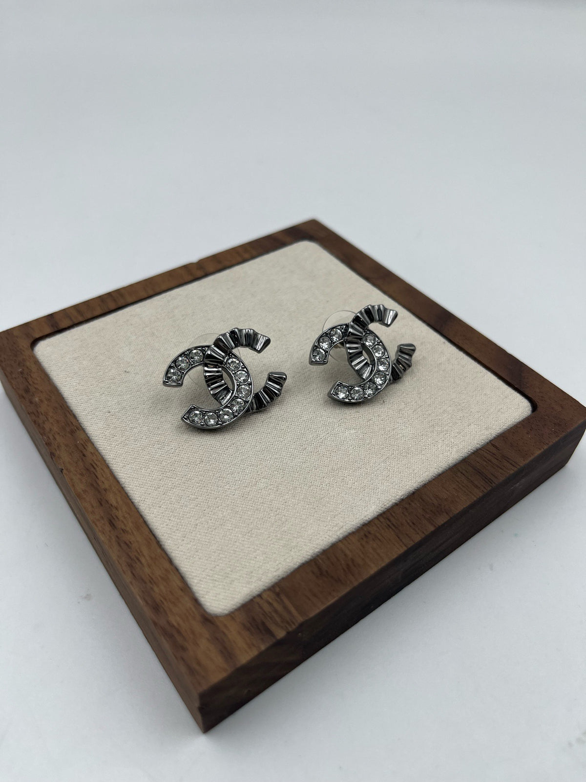 Chanel - Other - Gunmetal-tone metal with clear glass crystals. - Grey