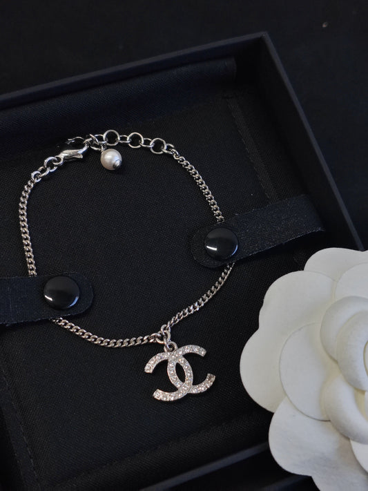 Chanel - Other - Metal alloy with glass crystals and a pearl accent; exact composition is not confirmed. - Silver