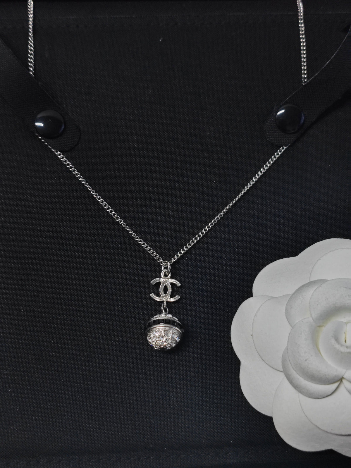 Chanel - Other - Metal base with clear rhinestone embellishment and dark accent details; exact composition is unconfirmed. - Silver