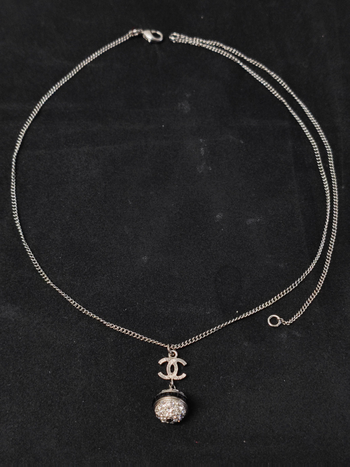 Chanel - Other - Metal base with clear rhinestone embellishment and dark accent details; exact composition is unconfirmed. - Silver
