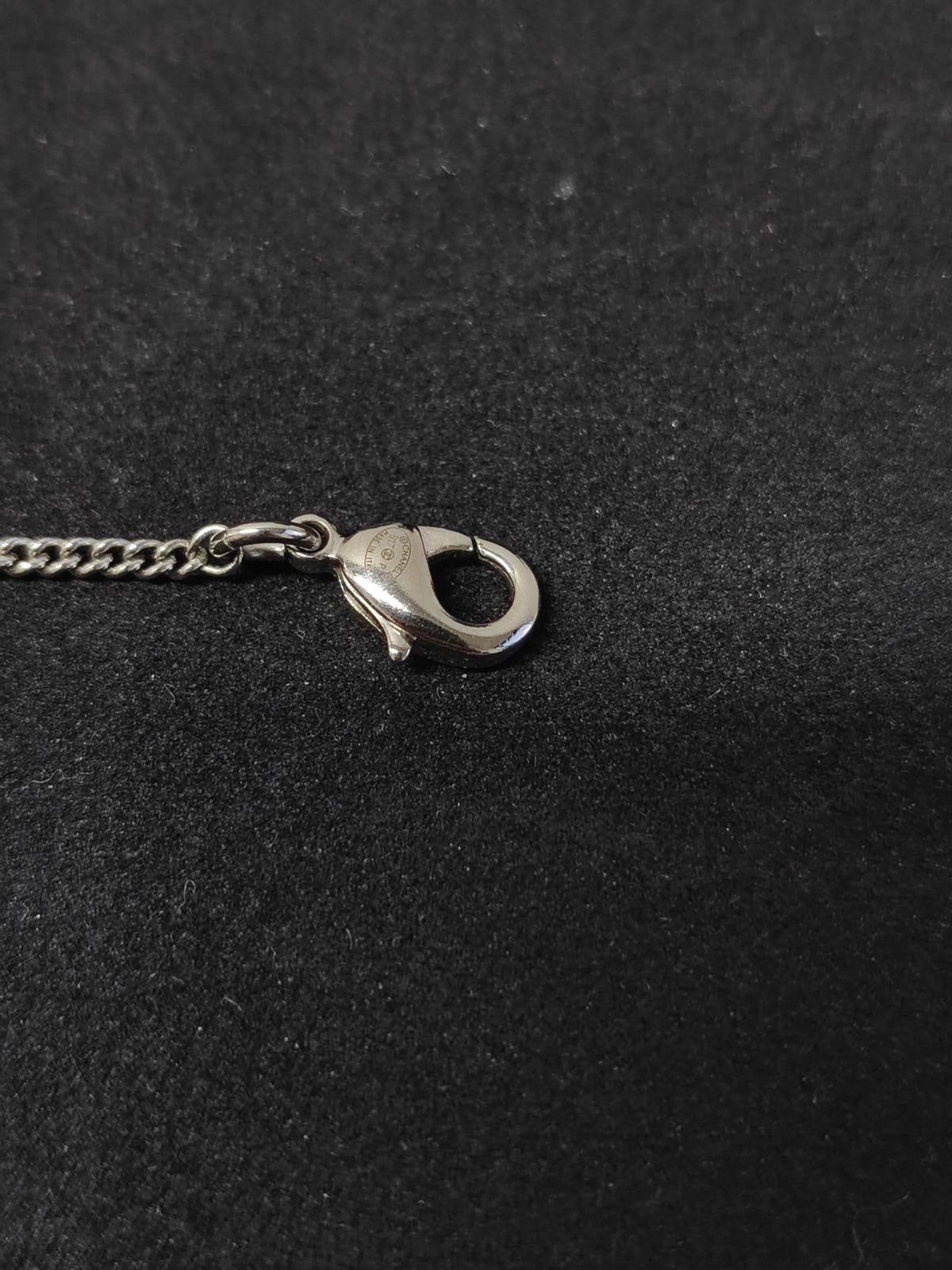 Chanel - Other - Metal base with clear rhinestone embellishment and dark accent details; exact composition is unconfirmed. - Silver