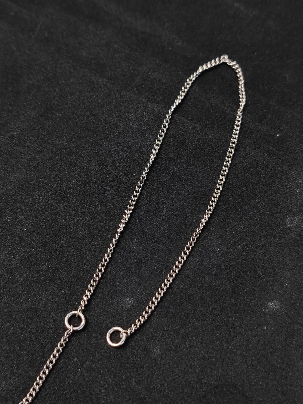 Chanel - Other - Metal base with clear rhinestone embellishment and dark accent details; exact composition is unconfirmed. - Silver