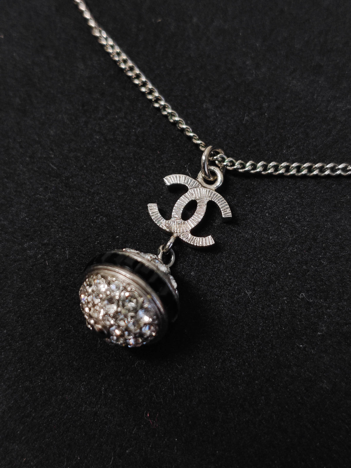 Chanel - Other - Metal base with clear rhinestone embellishment and dark accent details; exact composition is unconfirmed. - Silver