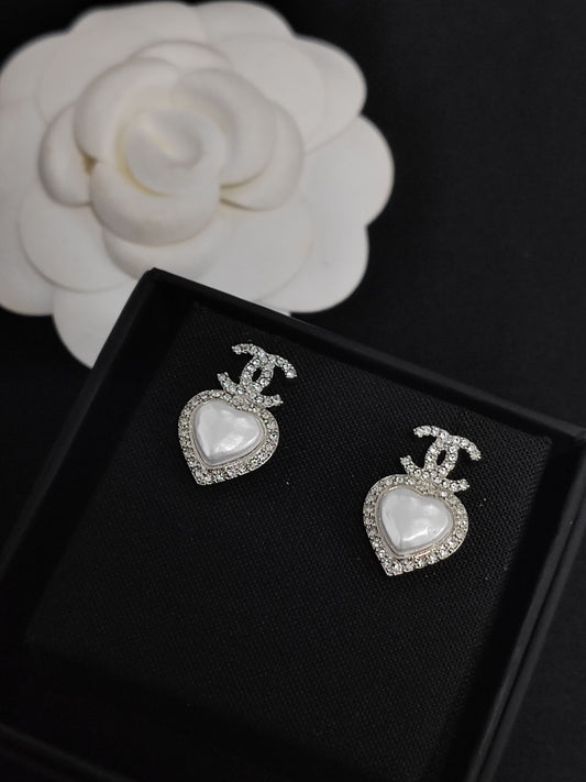 Chanel - Other - Metal setting with glass rhinestones and imitation pearl-style heart insets. - Silver