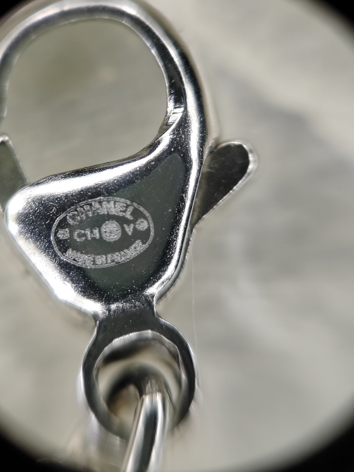 Chanel - Other - Metal with clear crystal accents and a pearl drop; exact pearl composition is unknown. - Silver