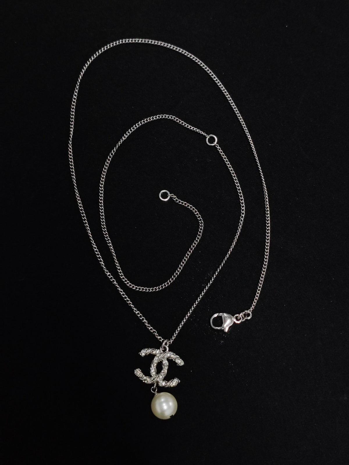 Chanel - Other - Metal with clear crystal accents and a pearl drop; exact pearl composition is unknown. - Silver