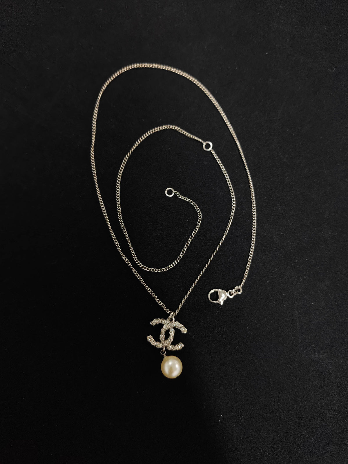 Chanel - Other - Metal with clear crystal accents and a pearl drop; exact pearl composition is unknown. - Silver