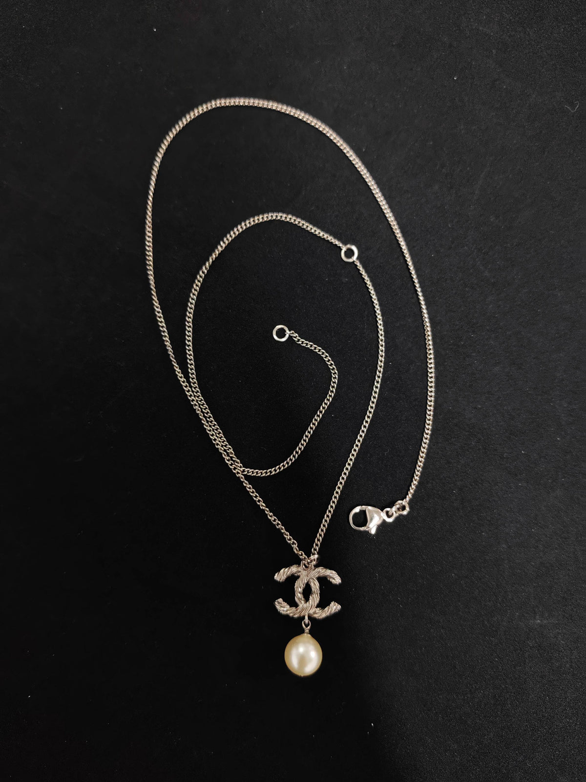 Chanel - Other - Metal with clear crystal accents and a pearl drop; exact pearl composition is unknown. - Silver