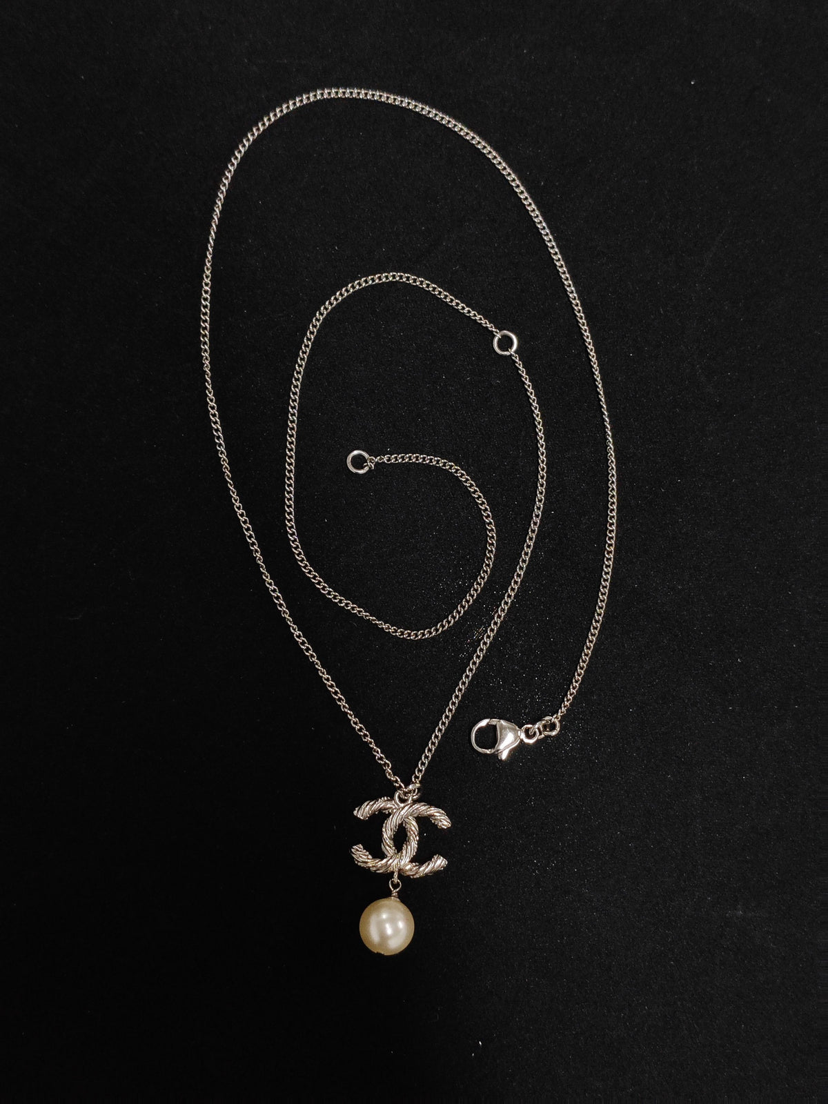 Chanel - Other - Metal with clear crystal accents and a pearl drop; exact pearl composition is unknown. - Silver