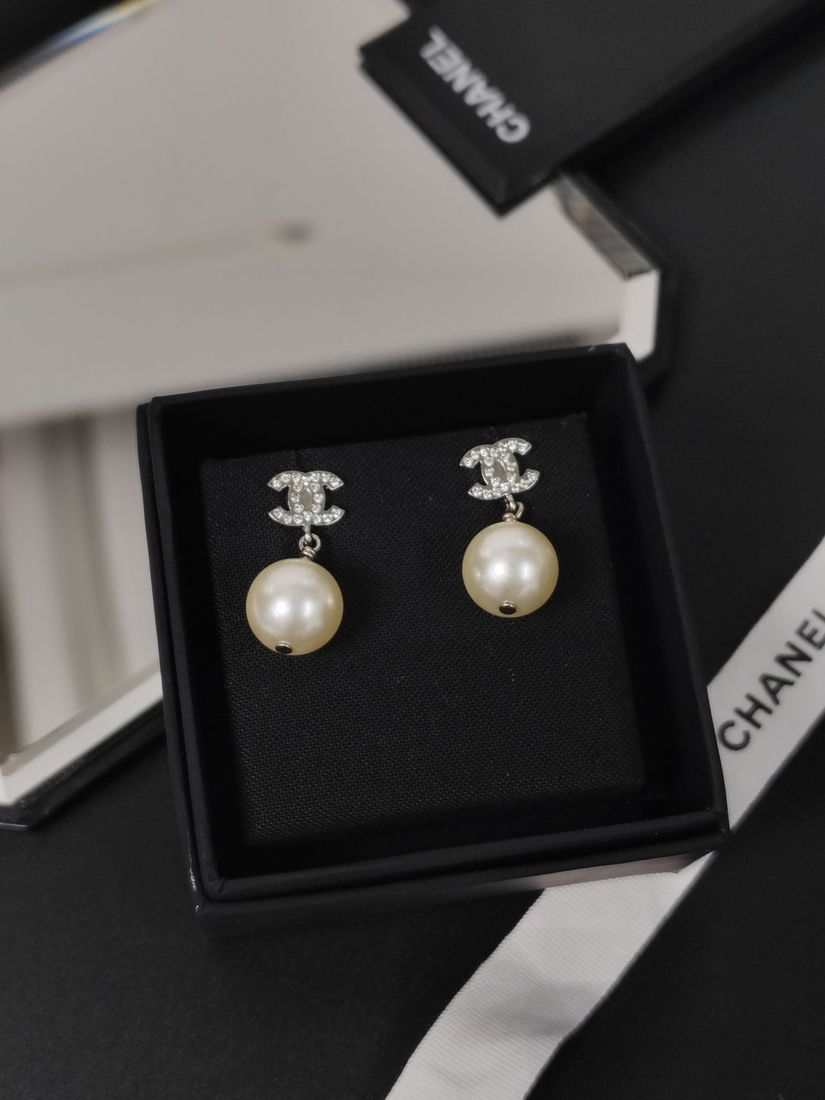 Chanel - Other - Metal with clear rhinestones and imitation pearls. - Silver