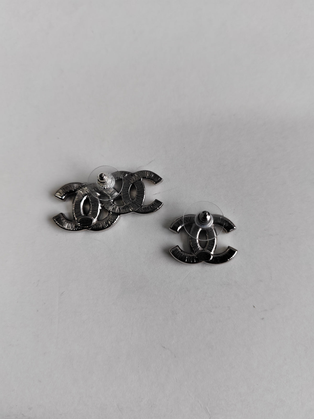 Chanel - Other - Metal with glass rhinestones; composition is not confirmed for this pair. - Silver