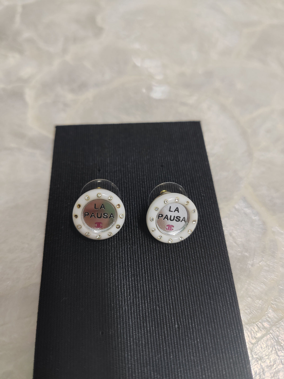 Chanel - Other - Metal with white resin and rhinestone accents; exact metal composition unspecified. - White